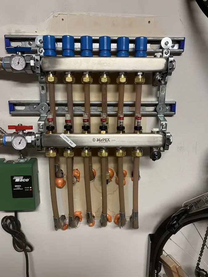 Plumber performing Gas Line Installation at a residential property in North Manchester